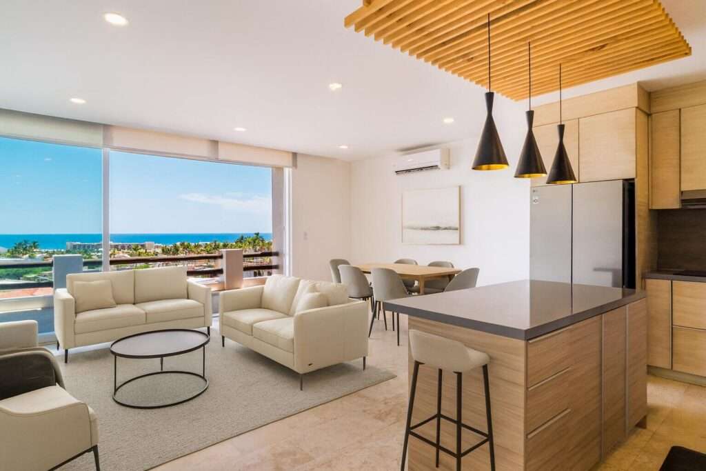 Los Cabos Villas Del Sol Great location, close to all amenities in Cabo San Lucas, walking distance to Medano Beach and to the CSL Marina, restaurants, bars, shops, supermarkets and all vibrant life in Cabo! This 115 m2 (1240 sqft) under AC condo has ceramic floor tiles, high vaulted ceilings, lots of natural light, back terrace with sink, electric water heater, AC mini splits and ceiling fans on each room, hardwood kitchen with propane stove, laundry closet, large living area, one parking space. Villa del Sol is a boutique gated community of only 22 private residencies with common palapa and pool area. Low HOAs. Walk everywhere, enjoy Cabo! – 702 Paseo de Las Misiones, San Jose del Cabo, BS