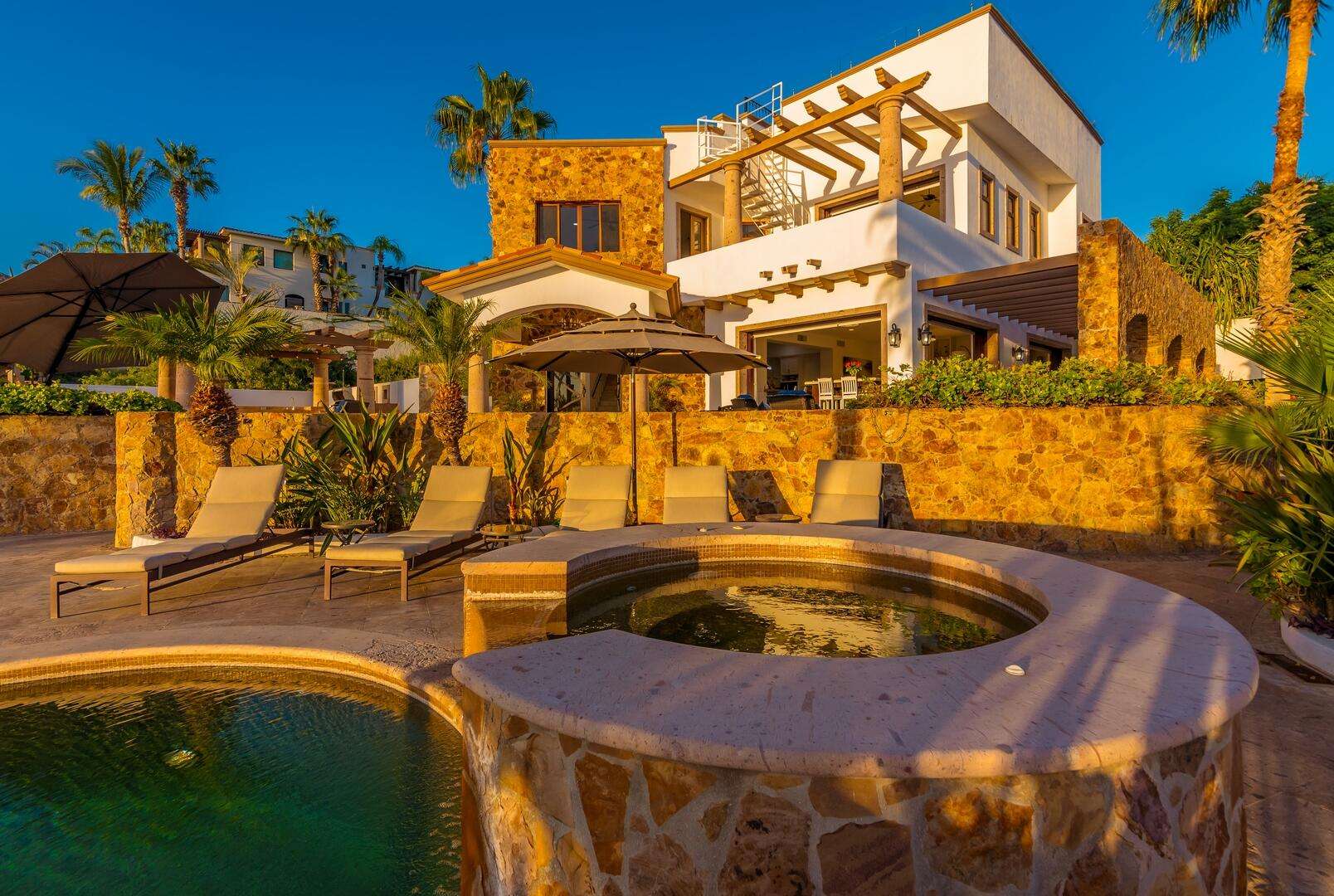 Los Cabos Cresta Del Mar Mediterranean-style Home with a poolside bar and generously proportioned patio with its water features, putting green, pool and spa create a playful inviting atmosphere where friends and family will want to gather. Sunset cocktails atop the rooftop deck with its arch for sale