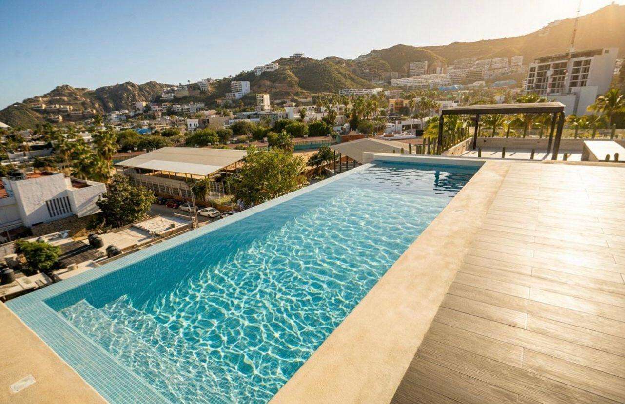 Los Cabos Best Suites Best Suites, comfort in the heart of San Lucas. Prime location just a 6-minute walk distance to Marina San Lucas. A complex with only 17 units offering an exceptional opportunity for investment and short or long-term rentals. Modern design. Infinity pool and roof garden with Marina for sale
