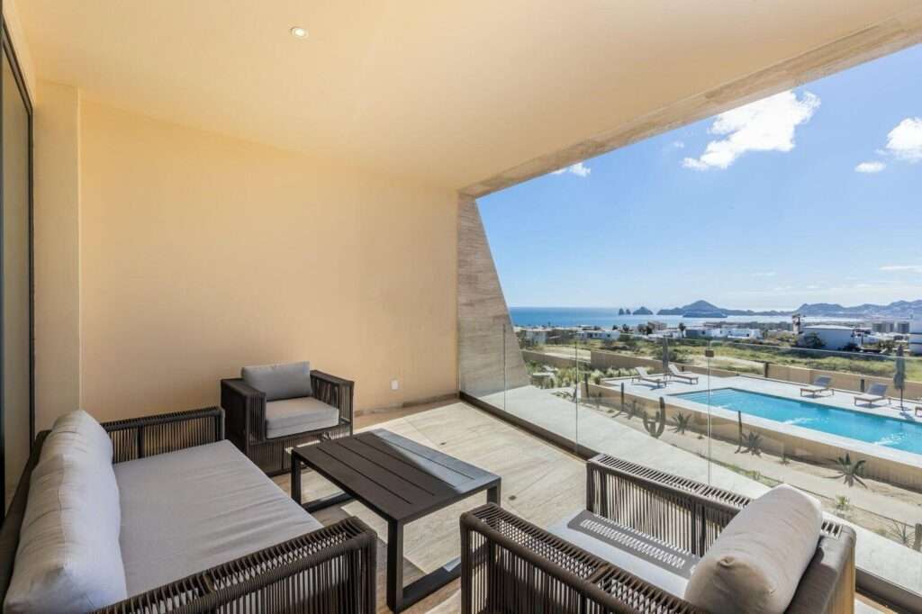 Los Cabos Villa La Estancia Luxurious 2-bedroom, 3-bath full-ownership residence located within one of only two beachfront resorts on Medano Beach in Cabo San Lucas. This spacious unit features a fully equipped kitchen with stainless steel appliances and pantry, opening to a comfortable living and dining area. The expansive primary suite offers a king bed, sitting area, workspace, and spa-style bath with Jacuzzi tub, walk-in shower, and double vanity. Guest bedroom includes two queen beds and en-suite bath. Both bedrooms and living area open to a large terrace with garden and ocean – Cabo Corridor, Cabo Corridor, BS