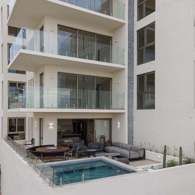 Los Cabos Cabo Costa TURNKEY FULLY FURNISHED 2-BEDROOM CONDO WITH PRIVATE PLUNGE POOL. Beautiful turnkey 2-bedroom ground-floor condo in Duna Tower at Cabo Costa, Cabo San Lucas. Features a private patio with dipping pool, ideal for seamless indoor-outdoor living and strong rental appeal. The unit offers two spacious en-suite bedrooms and a modern design with neutral finishes, creating a comfortable and inviting space.Cabo Costa is a newer community designed to blend architecture with nature, offering a tranquil and upscale environment.Amenities include clubhouse, infinity pool, gym, sundeck, kids' area, jacuzzi, wet bar, snack bar, and massage area.Ideal as a vacation home or investment property. for sale