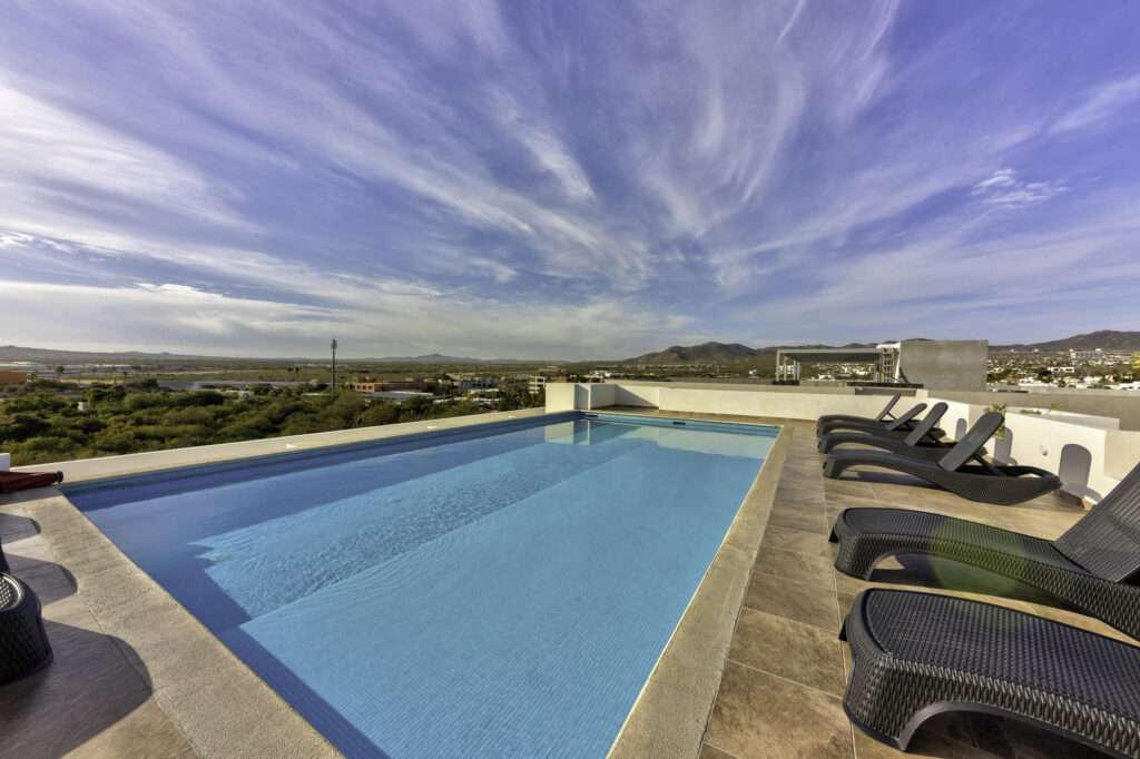 Los Cabos Luxotica Ii Luxotica delivers easy Cabo living in the Sunset area—close to the marina, restaurants, shopping, and beaches. This bright 2 bed / 2 bath third-floor condo comes fully furnished and equipped, ready to move in or rent immediately. Strong rental history makes it ideal for investors, seasonal owners, or full-time living. The unit includes private parking, plus access to a shared rooftop with panoramic – Camino al Riu, Cabo Corridor, BS