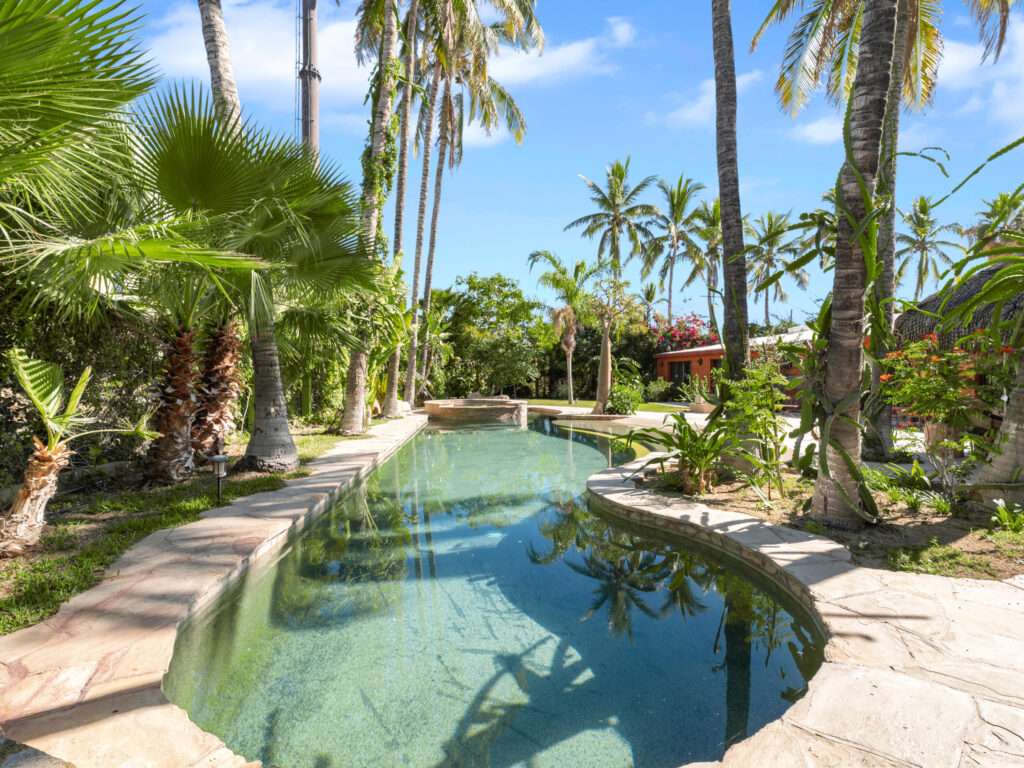 Los Cabos El Tezal-Oceanside:General Located along the highly sought-after Cabo Corridor, this charming 2-bedroom, 2-bathroom open-concept home is set within a lush, private garden oasis filled with mature tropical landscaping. The seamless indoor-outdoor layout flows effortlessly into a stunning lagoon-style pool, creating a peaceful, resort-like setting ideal for relaxing or entertaining.With its expansive grounds and prime location on the corridor just minutes from downtown Cabo San Lucas, the property offers incredible flexibility. Whether envisioned as a private residence, boutique event space and hotel, or future condo development, this is a rare opportunity to own a versatile property in one of Cabo's fastest-growing areas. – Casa Oasis Verde, Cabo Corridor, Cabo Corridor, BS