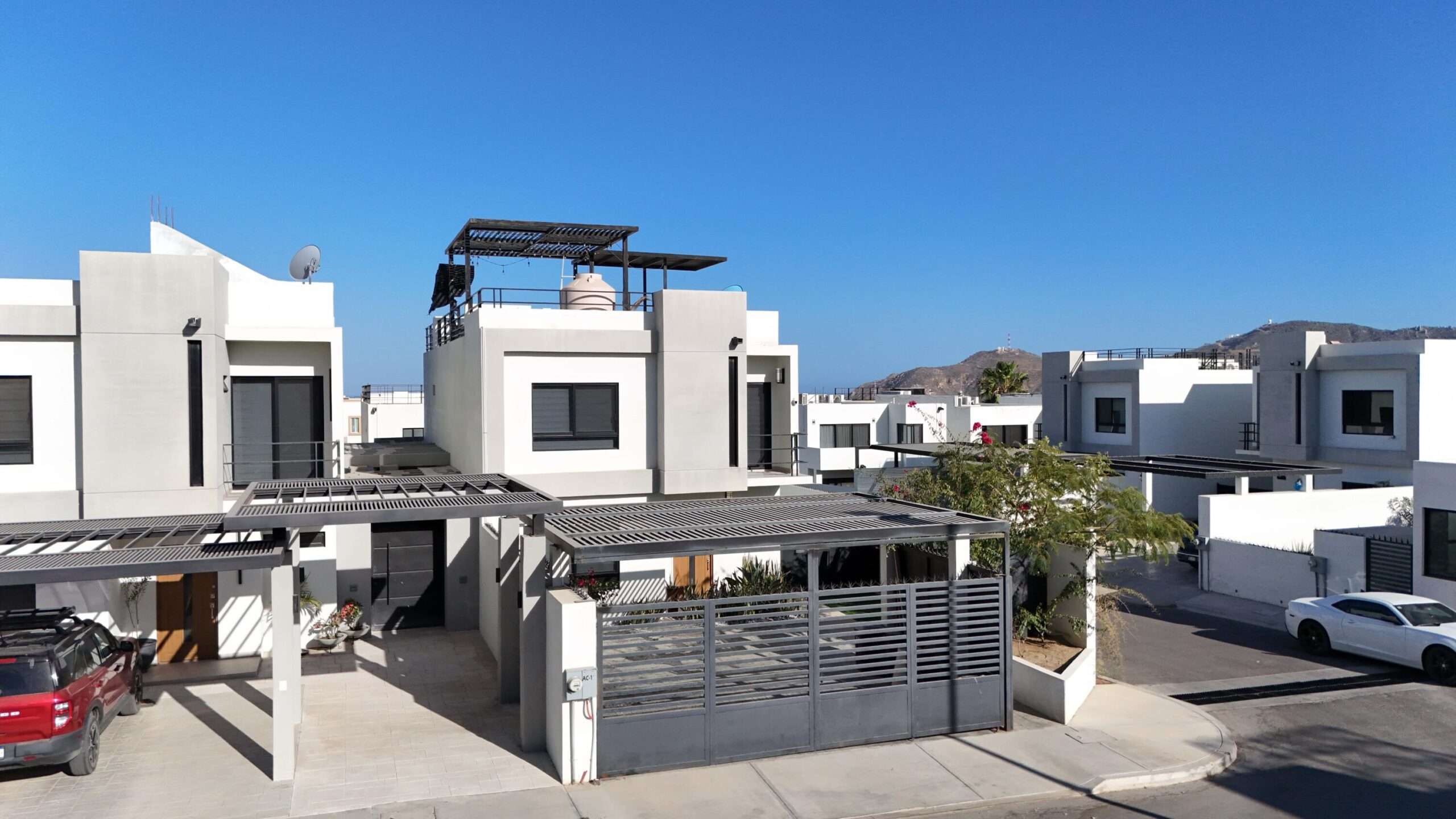 Los Cabos Terranova Beautiful turnkey two-story corner home located in the gated community of Terranova Residencial. The main level offers an inviting living and dining area, a kitchen with granite countertops and pantry. Also a flex room ideal as a guest bedroom or home office.The second level features three bedrooms, including a spacious primary suite with walk-in closet, bathtub, and double vanity, plus two additional bedrooms connected by a Jack-and-Jill bathroom.Enjoy a private backyard with an 80 mΒ² garden, swimming pool, and BBQ area, perfect for entertaining. The rooftop terrace with pergola and BBQ area offers beautiful sunset for sale
